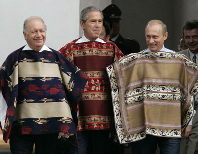 U.S. President Bush wearing a traditional Chilean poncho