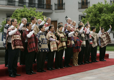 U.S. President Bush wearing a traditional Chilean poncho