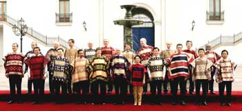 APEC leaders, wearing traditional Chilean ponchos, have their official photograph taken at La Moneda Sunday, November 21, 2004 in Santiago, Chile. 