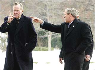 US President George W. Bush (R) points along with his father. former US President George H. W. Bush (L) after arriving back to the White House in 2002. A private jet that crashed in foggy conditions near Houston's Hobby Airport, killing all on board, was on its way to pick up former president George H.W. Bush.