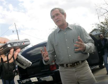 US President Bush talks with reporters before having lunch at a local coffee shop in Crawford, Texas Friday, Nov. 26, 2004. [AP]