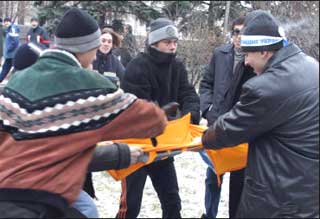 Supporters of Viktor Yanukovich tear to pieces an orange opposition flag during a pro-Yanukovich rally in Donetsk November 28, 2004. Ukraine's supreme court was set to hear an opposition appeal that the presidential election was rigged in favor of pro-Moscow Yanukovich, amid threats the country could split in two.