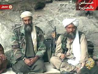 Osama bin Laden, left, with top lieutenant Ayman al-Zawahri, is seen at an undisclosed location in this television image broadcast Oct. 7, 2001. [AP]
