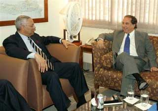In this photo released by the United Nations mission in Haiti (MINUSTAH), U.S. Secretary of State Colin Powell, left, speaks with the U.N. Special Representative Juan Gabriel Valdes during their meeting at the U.S. Embassy in Port-au-Prince, Haiti, Wednesday, Dec. 1, 2004. [AP] 