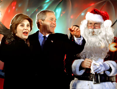U.S. President Bush and his wife wave standing beside Santa Claus