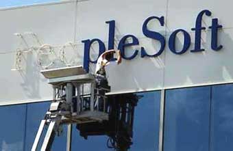 Business software maker PeopleSoft Inc. has accepted a sweetened $10.3 billion acquisition offer from rival Oracle Corp., ending a bitter, 18-month hostile takeover battle, the companies said on December 13, 2004. Letters are removed that make up the PeopleSoft logo at the company's headquarters in Pleasanton, California, June 18, 2003. Photo by Tim Wimborne/