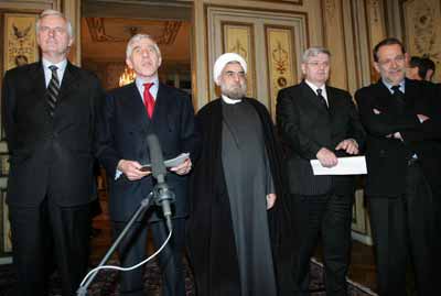 Iran's chief nuclear negotiator Hassan Rohani (C) holds a joint news conference with French Foreign Minister Michel Barnier (L), British Foreign Secretary Jack Straw (2ndL), German Foreign Minister Joschka Fischer (2ndR) and EU foreign policy chief Javier Solana (R) in Brussels December 13, 2004. European foreign ministers voiced caution before the start of talks with Iran on Monday on a long-term agreement on nuclear, economic and strategic cooperation, and Tehran vowed to continue disputed research. The negotiations follow Iran's agreement last month to suspend activities that could help make a nuclear bomb. [Reuters]