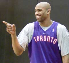 Toronto Raptors Vince Carter laughs during team practice.