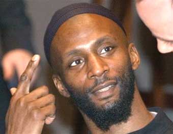Briton Jamal al-Harith, a former inmate at Guantanamo Bay, gestures after his testimony to Europe's top human rights body in Paris Friday, Dec. 17, 2004. Al-Harith said he was beaten, shackled, kept in a cramped cage and fed rotten food as part of systematic abuse during his two years at the U.S. detention facility. Detained in Afghanistan in 2001, al-Harith maintains he never had any ties with terrorism. He was returned to Britain in March. [AP]