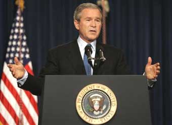 US President Bush answers questions during a press conference on the White House compound in the Eisenhower Executive Office Building, Monday, Dec. 20, 2004, in Washington. [AP]