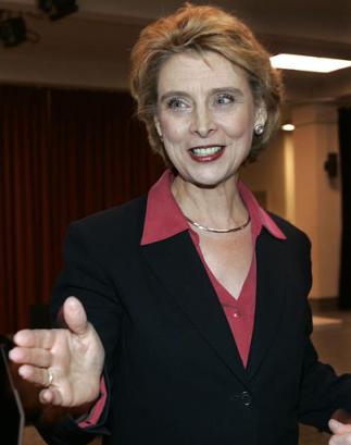 Christine Gregoire smiles as she spends some time with family members, following a news conference held, Wednesday, Dec. 22, 2004, in Seattle, after results from a hand recount in the close Washington governor's race were announced, that showed Gregoire had a 10-vote advantage over Republican Dino Rossi. [AP]