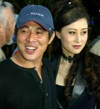 Action star Jet Li (L) and wife Nina are seen at the June 17, 2003 premiere of "The Hulk" in Los Angeles. The action film star of "Hero" and "Lethal Weapon 4" rescued his daughter as the Indian Ocean tsunami swept his hotel in the Maldives December 26, 2004. Li suffered minor injuries as he fled the rising waters.[Reuters]