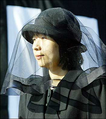 Japanese Princess Sayako leaves the Toshimagaoka cemetery after attending the funeral ceremony for late Princess Kikuko, an aunt of Emperor Akihito, in Tokyo 26 December 2004. Princess Kikuko, also known as Princess Takamatsu, died on December 18 in Tokyo at the age of 92. [AFP/file]