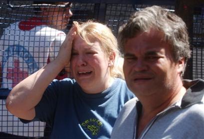 A couple reacts as they leave the local morgue after identifying their loved one in Buenos Aires, Argentina, Friday, Dec. 31, 2004. A flare lit during a rock concert ignited the foam ceiling of a Buenos Aires nightclub packed with teenagers late Thursday, starting an inferno that killed 175 people and injured more than 600, officials and witnesses said Friday. (AP Photo/Daniel Luna) 