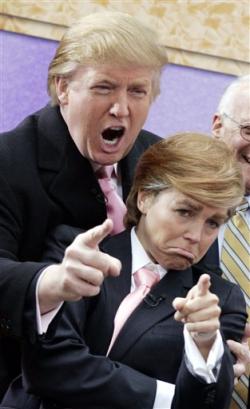 Katie Couric, right, co-host of NBC-TV's 'Today' show, is dressed like Donald Trump, left, who gives his signature 'You're Fired' exclamation during the morning program's annual Halloween segment, Friday Oct. 29, 2004. From wardrobe malfunctions to erectile disfunction, it's been a tough year all around for the guardians of the English language. More than 2,000 nominations arrived in Michigan's Far North, where a committee at Lake Superior State University compiled its annual compilation of language irritants. (AP Photo/Richard Drew, file) 