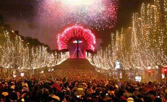 Fireworks are seen around the Ferris Wheel on the Champs Elysee avenue to celebrate the New Year as well as Paris' bid to host the 2012 Olympic games, in Paris Saturday Jan.1, 2005. [AP] 