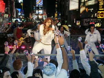 Pop singer Lindsey Lohan performs her song "Rumors" as part of the New Year's Eve celebrations in Times Square, December 31, 2004. A century after the first New Year's Eve celebrations in Times Square, hundreds of thousands of revelers turned out in unseasonably warm weather to watch the ball drop atop One Times Square to signal the start of the New Year. 