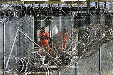 Al-Qaeda and Taliban prisoners wash before midday prayers at Camp X-Ray, the US Naval Base at Guantanamo Bay, Cuba. A British detainee was reportedly tortured at the US base at Guantanamo Bay, Cuba for reciting the Koran when talking was banned.[AFP/file]