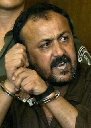 Israeli authorities decided on January 5, 2004 to let jailed Palestinian revolt leader Marwan Barghouthi out of his isolation cell on Wednesday in what appeared to be a goodwill gesture ahead of Palestinian elections, security sources said. Barghouthi shouts in Tel Aviv's city court in this file photo taken August 14, 2002. (Oleg Popov/Reuters) 