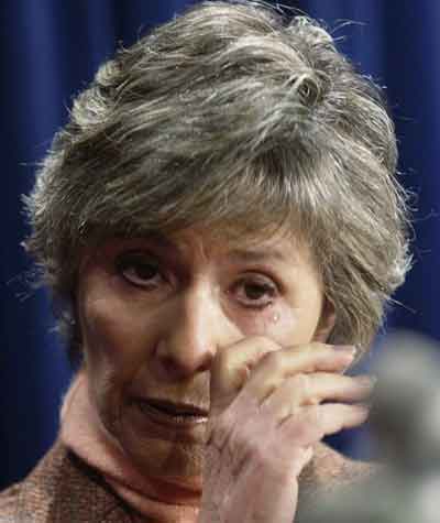United States Senator Barbara Boxer wipes tears from both her eyes as she listens to U.S. Representative Stephanie Tubbs Jones discuss their filing of a formal objection to the certification of President George W. Bush's general election presidential votes from the State of Ohio at the U.S. Capitol in Washington January 6, 2005. [Reuters]