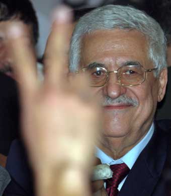 Palestinian presidential candidate Mahmoud Abbas celebrates after the close of voting in the West Bank city of Ramallah January 9, 2005. Mahmoud Abbas won election as Palestinian president by a landslide on Sunday, securing a strong mandate to talk peace with Israel after years of bloodshed and to end corruption at home. 