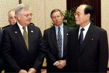 Senior U.S. congressman, Republican Curt Weldon (L) of Pennsylvania speaks with North Korea's number two leader Kim Yong-nam in Pyongyang January 14, 2005. Negotiations on North Korea's nuclear programmes can and will resume in weeks rather than months, said Weldon, vice chairman of the Houes Armed Services Committee, following talks with parliament president Kim, second-in-command to Kim Jong-il. 