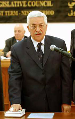 Mahmoud Abbas is sworn in as Palestinian president to succeed Yasser Arafat, in Ramallah, January 15, 2005. Abbas called for a cease-fire with Israel and talks on a final peace settlement, but the ceremony at the battered West Bank compound was overshadowed by Israel's decision to cut all contacts with the Palestinians after militants killed six Israelis. [Reuters]