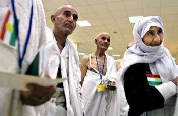 Iraqi Kurdish pilgrims wait at Arbil's International Airport before getting on a direct flight to Saudi Arabia for Hajj, in northern Iraq , January 3, 2005. Some 6000 Iraqi Kurdish pilgrims will be assisted by Kurdish regional government to reach Muslims most Holy sights of Mecca in the next few days for Hajj. For the first time Kurdish people had a chance to embark on the planes in Iraqi Kurdistan for direct flights to Saudi Arabia and symbolically launch Arbil airport as effectively international one. Picture taken January 3, 2005.