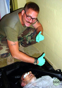 A picture obtained by ABC News and released May 19, 2004 shows a man identified as Sgt. Charles Graner posing over the body of detainee Manadel a-Jamadi in Abu Ghraib prison, in Iraq. Spc. Charles Graner Jr. was convicted by a military jury on January 14, 2005, of abusing Iraqi prisoners at the Abu Ghraib prison in a scandal that badly damaged America抯 reputation after the U.S. invasion of Iraq. A 10-member military jury found Graner, 36, a former civilian prison guard, guilty on all 10 charges, although it altered one count to a lesser charge of assault rather than use of force likely to produce death or grievous bodily harm in one attack. [REUTERS/HO/ABC News]