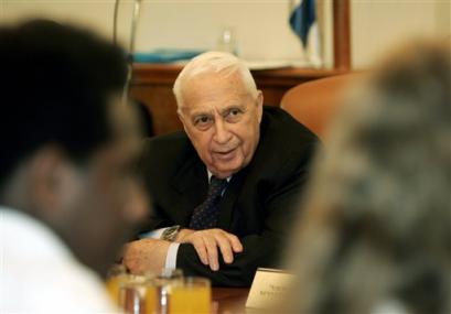 Israeli Prime Minister Ariel Sharon listens to Israeli youths, during a meeting at his office in Jerusalem Sunday Jan. 16, 2005. Sharon on Sunday said he has ordered Israeli forces to intensify military operations to stop Palestinian attacks, adding that the military would act without restrictions until Palestinian leaders take action against militants themselves. [AP]