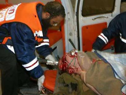 An Israeli man is carried from an ambulance at a hospital in the town of Beer Sheba January 18, 2005 after a Palestinian suicide bomber blew himself up near an Israeli army military base in Gush Katif. A Hamas suicide bomber blew himself up near Israeli troops in the Gaza Strip on Tuesday shortly after Palestinian Prime Minister Mahmoud Abbas arrived in the occupied territory to press militants to lay down their arms. [Reuters]