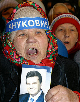 Supporters of former Ukrainian Prime Minister Viktor Yanukovich shout during a rally in downtown Donetsk. Ukraine's supreme court justices began their deliberations over the final appeal of Viktor Yushchenko's election as president. [AFP]