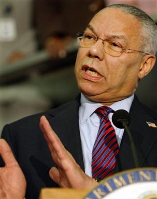 US Secretary of State Colin Powell gestures during his farewell speech to State Department employees on Wednesday, Jan. 19, 2005 in Washington. [AP]