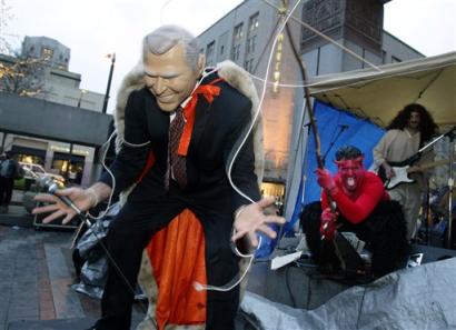 A band portraying US President Bush as a marionette controlled by Satan performs at a protest against the inauguration of President Bush and the war in Iraq Thursday, Jan. 20, 2005, in downtown Seattle. [AP]