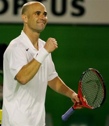 Andre Agassi of the U.S. pumps his fist as he celebrates after his third round match against compatriot Taylor Dent on Rod Laver Arena at the Australian Open at Melbourne Park, Melbourne, Australia, Friday, Jan. 21 2005. Agassi defeated Dent in straight sets 7-5 7-6 6-1. [AP]