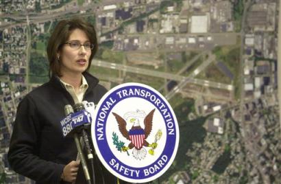 Deborah Hersman of the US National Transportation Safety Board answers a question about a corporate jet crash during a news conference at the Teterboro Airport administration building in Moonachie, New Jersey, Wednesday, Feb. 2, 2005. The jet ran off the end of a runway while attempting a take off, crossed a six-lane highway and crashed into a clothing warehouse. Hersman said their were no fatalities reported. [AP]