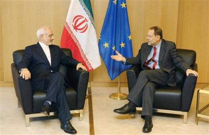 European Union Foreign and Security Policy representative Javier Solana, right, talks with Iran's Vice-President and head of Iran's Atomic Energy Organisation Gholamreza Aghazadeh in Solana's office at the European Council headquarters in Brussels, Tuesday Feb. 1, 2005. [AP]
