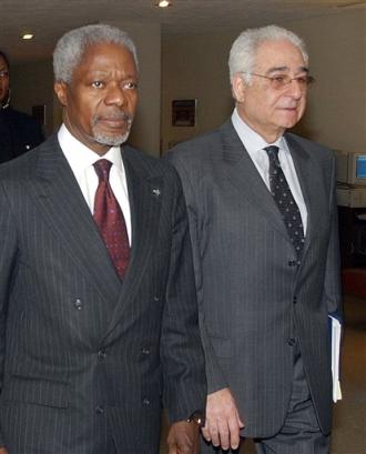 United Nations Secretary General Kofi Annan, left, walks with Benon Sevan, executive director of the United Nations Office of Iraq Program, following a meeting at U.N. headquarters in this April 3, 2003 file photo. [AP/file]
