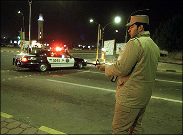 Kuwaiti security forces take position during a raid at Sulaibiya in Kuwait City. Three Jordanian and two Saudi wanted militants surrendered to Kuwaiti security forces after the raid on a suspected hideout, the interior ministry said.(AFP/Yasser al-Zayyat) 