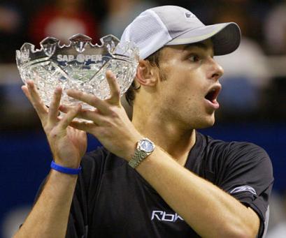 Andy Roddick reacts as he watches a woman being proposed to by her boyfriend on the court during the awards presentations at the SAP Open, Sunday, Feb. 13, 2005, in San Jose, Calif. Roddick beat Cyril Saulnier of France 6-0, 6-4. [AP]