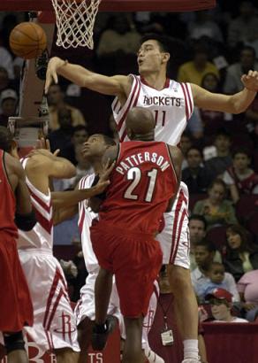 Houston Rockets center Yao Ming (11) of China blocks a shot by Portland Trail Blazers forward Ruben Patterson (21) in the first half Sunday, Feb. 13, 2005, in Houston. [AP]