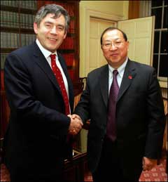 China has become a vital driver of global growth and protectionist voices raised against it are engaged in a 'sterile attempt to stop the clock', British Finance Minister Gordon Brown (R), seen with Chinese finance minister Jin Renqing in this file photo, is due to tell a Beijing audience later Monday, February 21. [AFP]