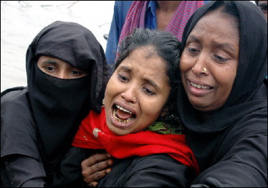 Three Bangladeshi women mourn after recovering the bodies of dead relatives, following a ferry disaster near Dhaka(AFP/Farjana K. Godhuly)
