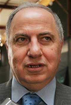 Chief of the Iraqi National Congress Ahmed Chalabi leaves after a meeting of Shiite Alliance leaders at the headquarters of the Supreme Council of the Islamic Revolution in Iraq in Baghdad, Iraq Monday, Feb. 21, 2005. [AP]