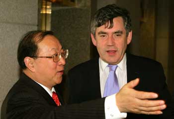 Britain's Chancellor of the Exchequer Gordon Brown (R) meets Chinese Finance Minister Jin Renqing during his visit to China's capital Beijing February 21, 2005. Brown said on Monday that orderly capital account liberalisation was the way forward for modern economies, including China. 