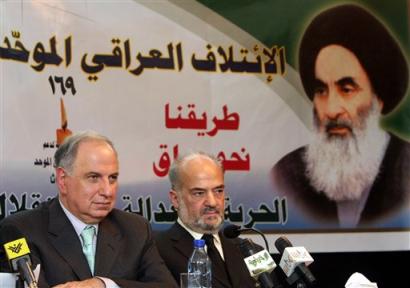 Interim Vice President Ibrahim al-Jaafari, right, who was chosen Tuesday as the Shiite ticket's candidate for Iraq's next prime minister after Ahmad Chalabi, left, dropped his bid, gives a press conference under a banner of Grand Ayatollah Ali al-Sistani at the headquarters of the Supreme Council of the Islamic Revolution in Iraq in Baghdad, Iraq Tuesday, Feb. 22, 2005. [AP]