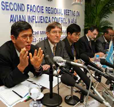 The World Health Organisation's regional director, Dr. Shigeru Omi (L), makes comments during a press conference on the final day of the Second FAO/OIE Regional Meeting on Avian Influenza Control in Asia in Ho Chi Minh City February 25, 2005. Bird flu experts meeting in Ho Chi Minh City say the virus, which has killed 46 people in Asia since it erupted at the end of 2003, is now endemic in parts of the region despite the slaughter of 140 million birds. Sitting to the right of Omi is Samuel Jutzi, the Animal Production and Health Division director of the United Nations' Food and Agriculture Organization. [Reuters]