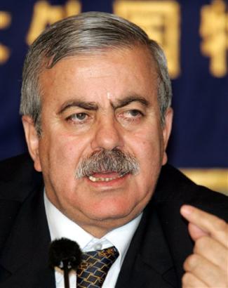 Ziad al-Khasawneh, who heads a committee set up to provide Saddam Hussein's legal defense, speaks during a press conference at the Foreign Correspondents' Club of Japan in Tokyo Tuesday, March 1, 2005. Al-Khasawneh condemned plans to try the former Iraqi leader in a U.S.-funded special court, saying it is illegitimate, and said that he and other members of Saddam's defense team have been denied access to him. [AP]