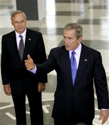 US President Bush talks to reporters after he received an intelligence briefing at CIA Headquarters in Langley, Va., near Washington, Thursday, March 3, 2005. He is joined by Director of Central Intelligence Porter Goss at left. [AP]