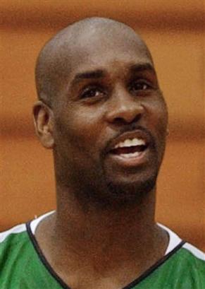 Gary Payton smiles during the first day of training camp with the Boston Celtics in Burlington, Vt., Tuesday, Oct. 5, 2004. Antoine Walker is coming back to Boston after the Celtics agreed to trade Payton, Tom Gugliotta and Michael Stewart to Atlanta on Thursday, Feb. 24, 2005. [AP/file]